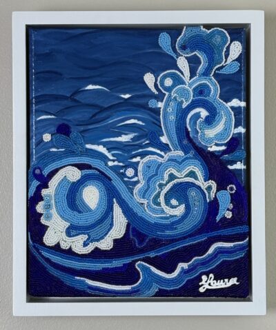 Blue and white beaded waves curl across a painted ocean background in Water, a small bead mosaic in a white frame.