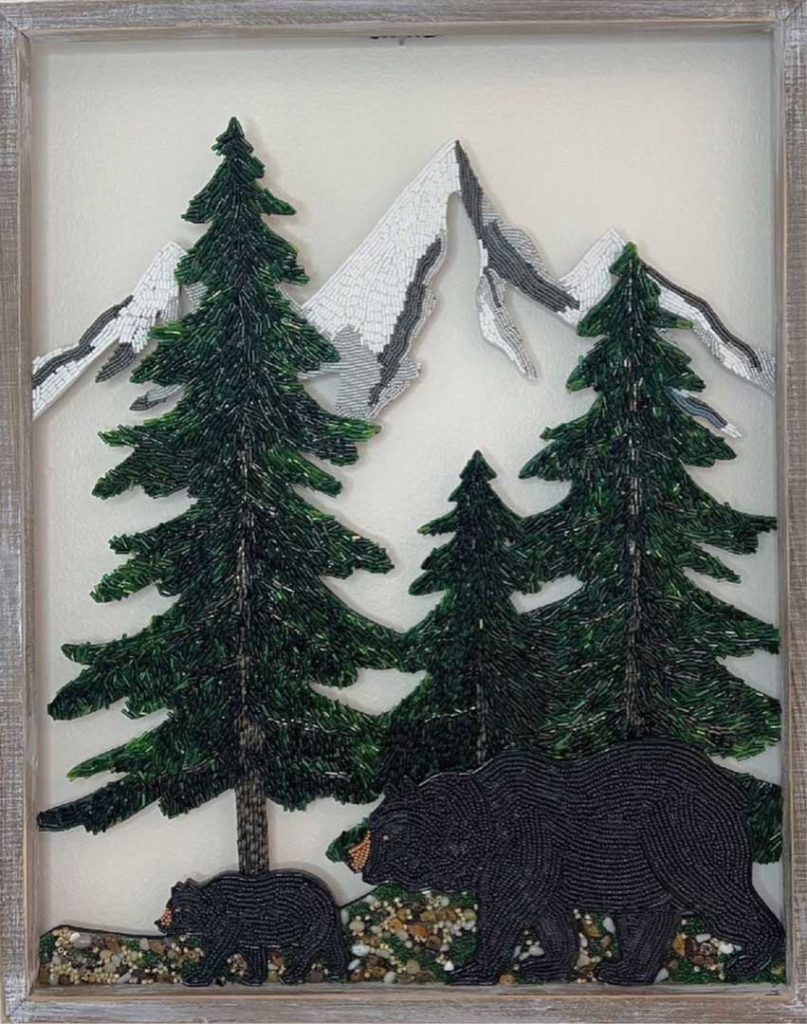 Bears at forest with mountains on the background