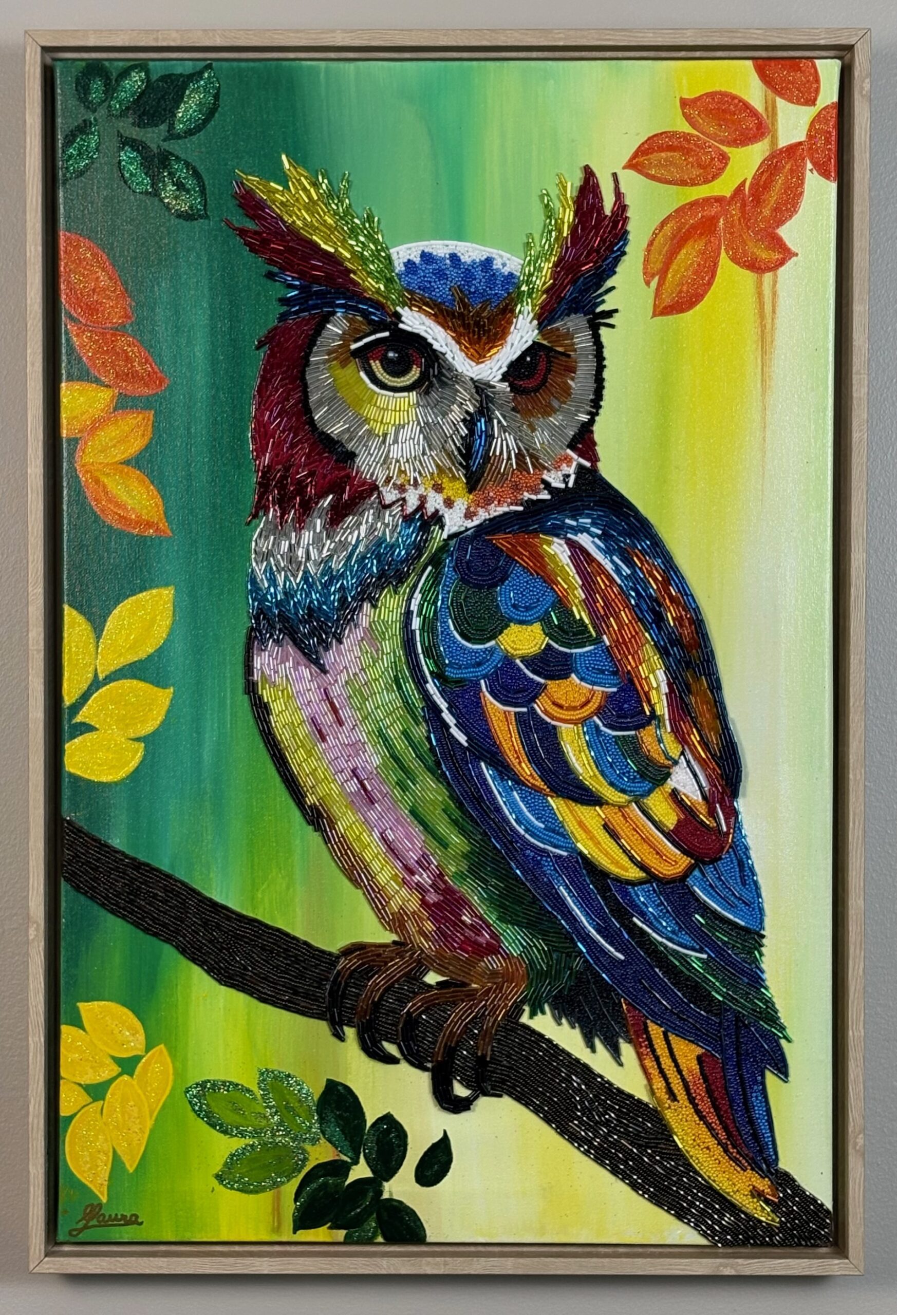 Colorful owl bead mosaic with layered seed beads and bugle beads on a painted background