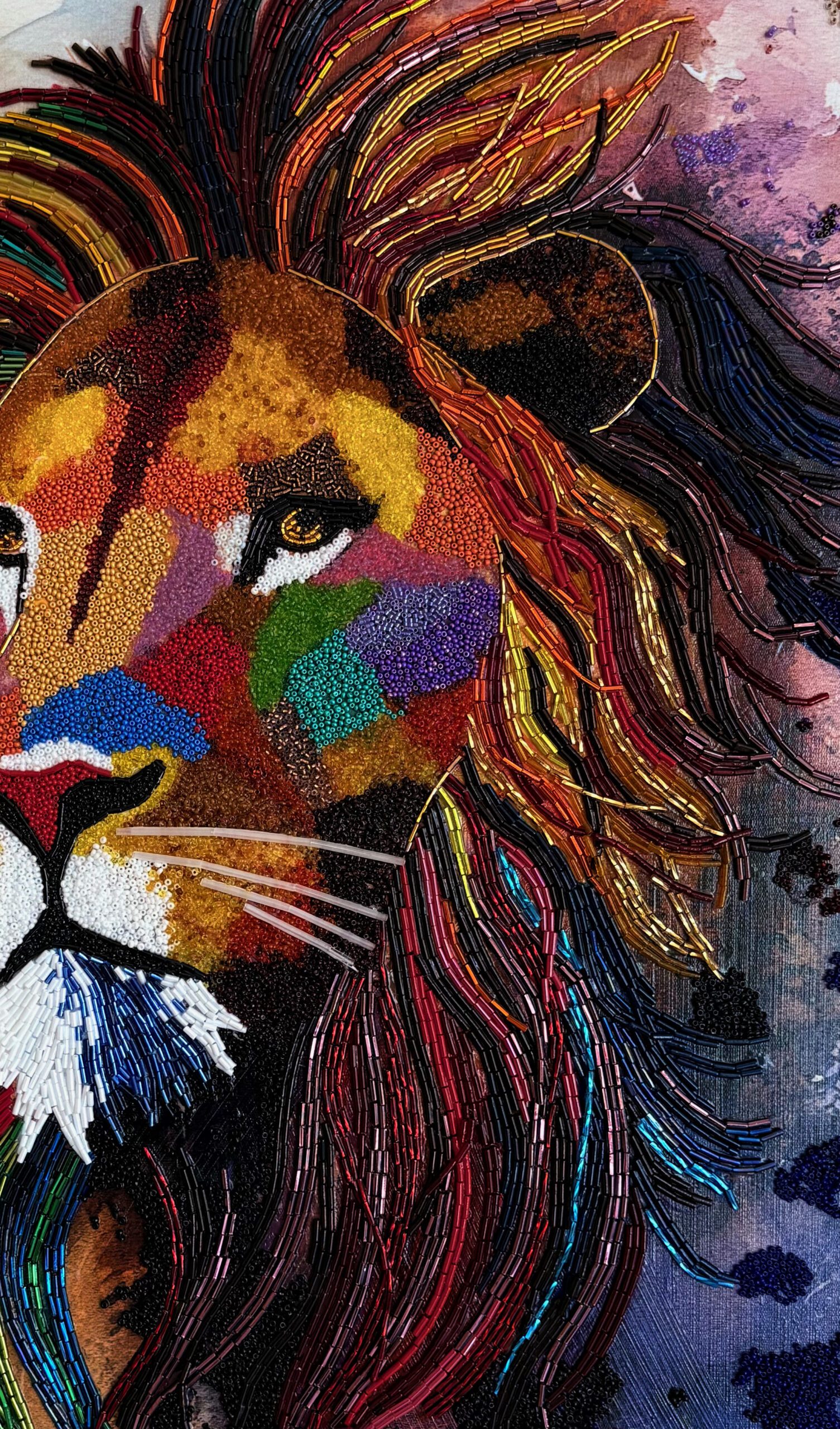 Detail of a contemporary bead mosaic lion showing directional beadwork, texture and reflected light.