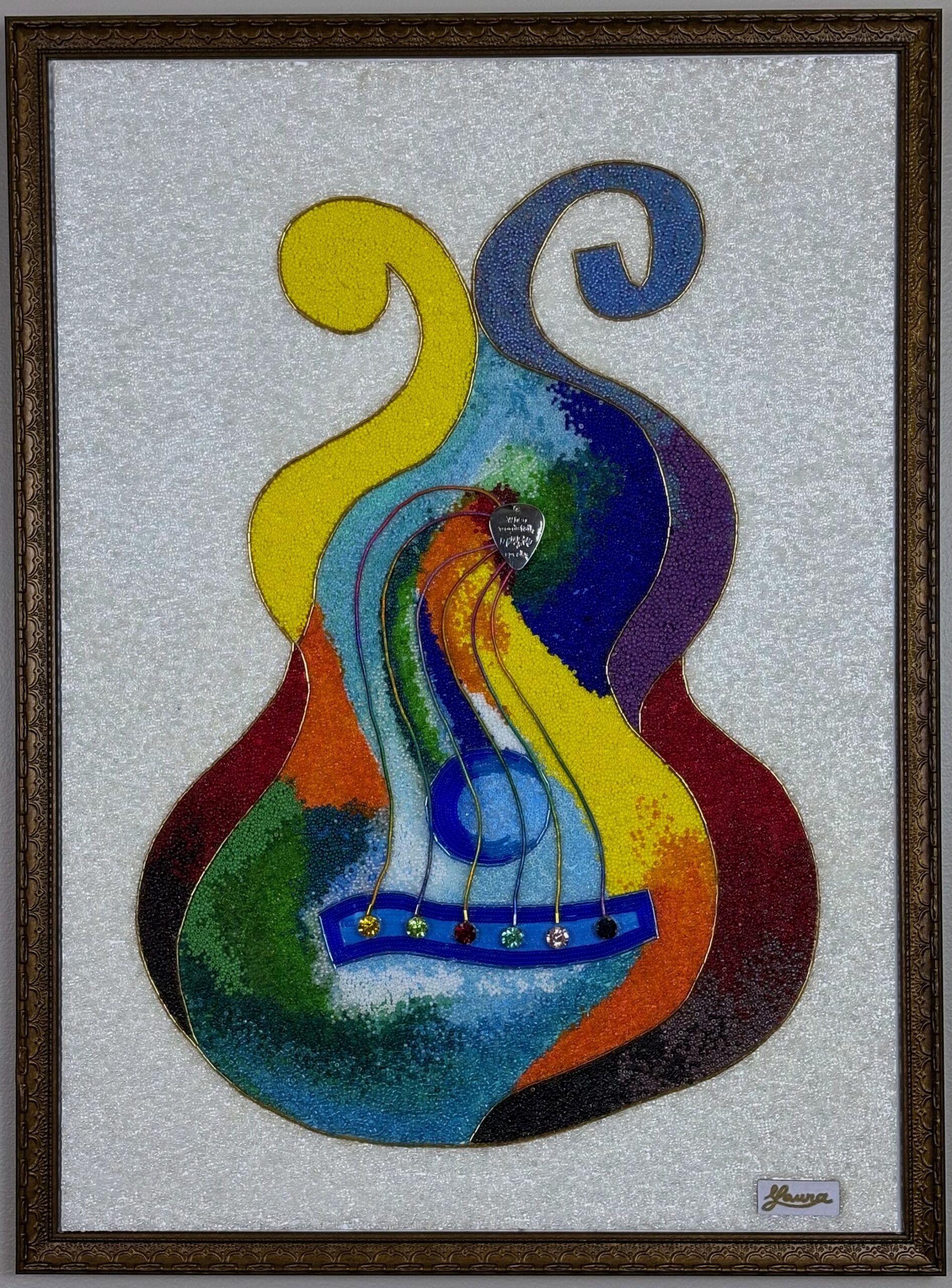 Colorful guitar-shaped bead mosaic on a luminous white background with curved abstract forms and an ornate bronze frame